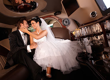 bride and groom in the limo