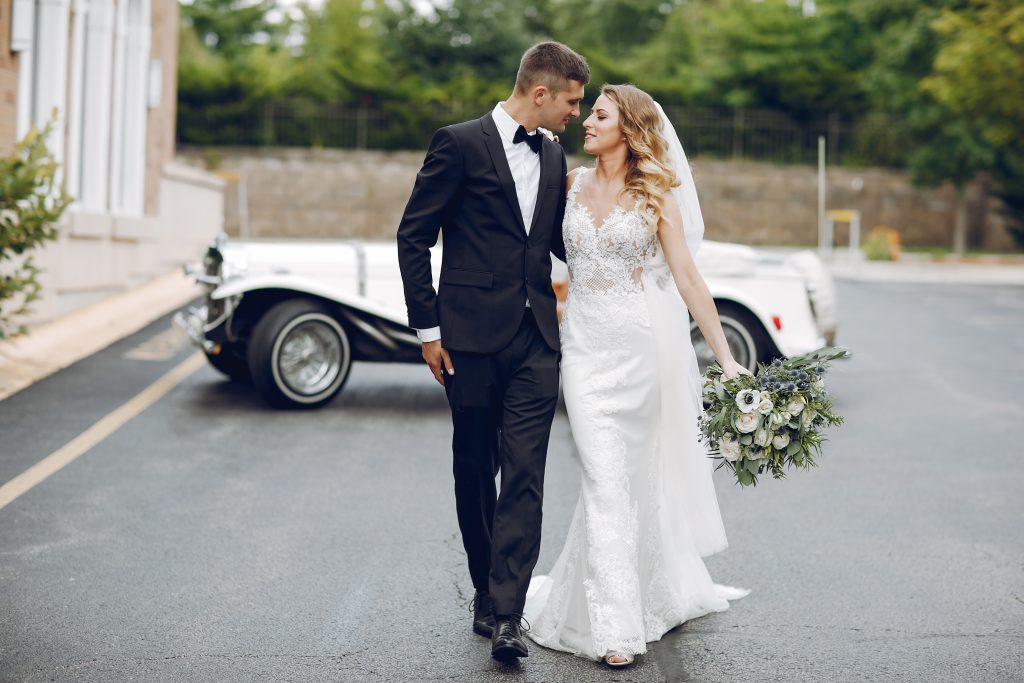 Couple near limousine car